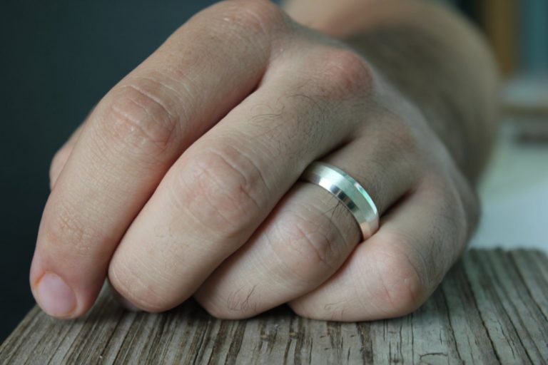 hand with silver rings