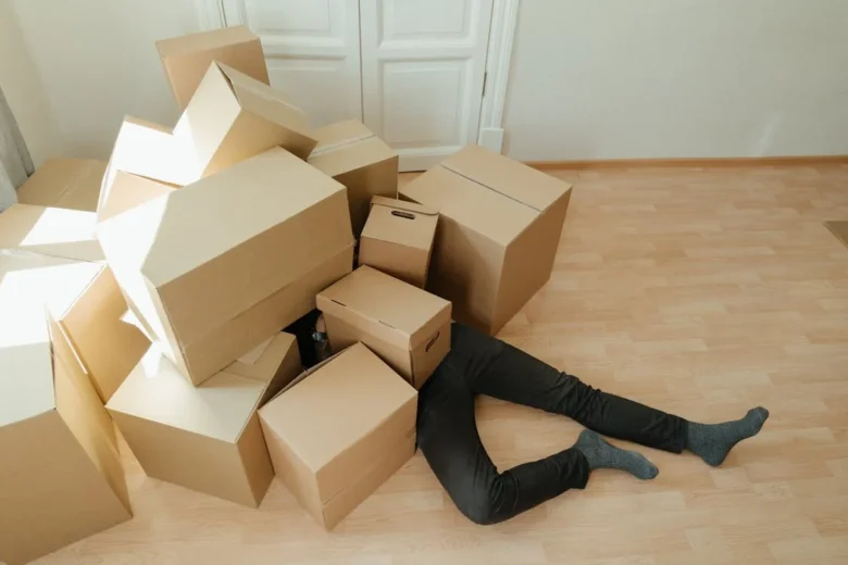 man fell under the boxes