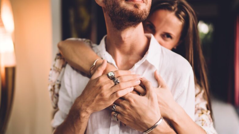 A couple in a close embrace during an intense early dating moment
