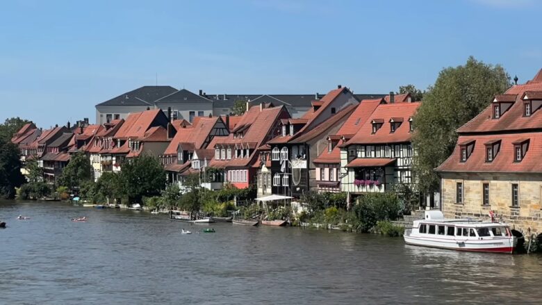 Bamberg riverside old town with half-timbered houses and a boat on the water