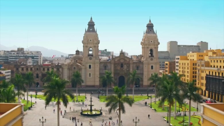 Historic cathedral and palm-lined plaza in Lima, Peru