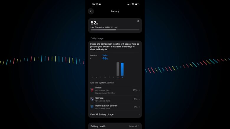 iPhone battery menu shows 52% charge on a dark test screen