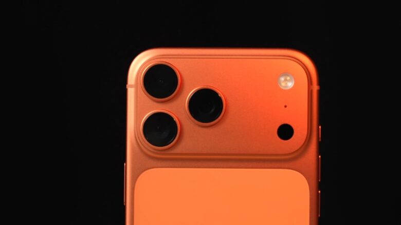 Close-up of an orange iPhone 17 Pro Max rear camera module