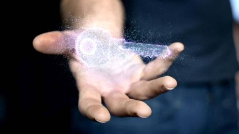 A person holds a bright digital key above an open hand