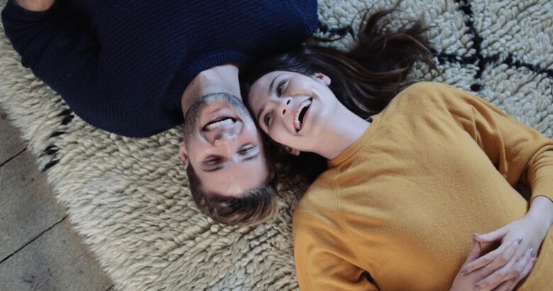 Relaxed adult couple sharing a comfortable private moment before discussing sexual interests