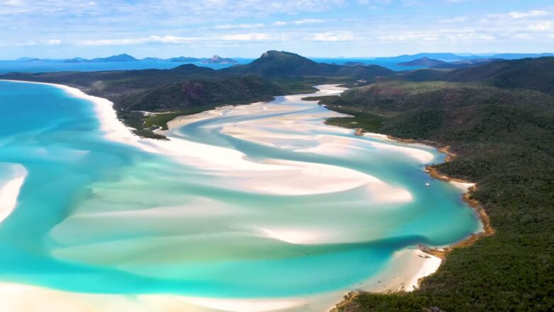 Aerial view of Whitehaven Beach with white sand and turquoise water in the Whitsunday Islands.