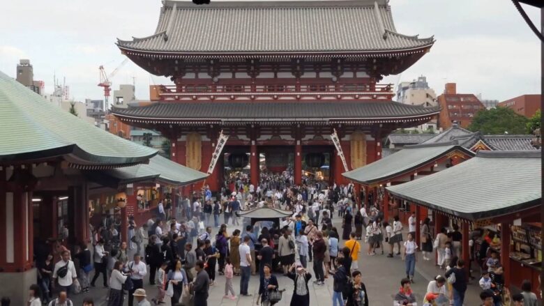 Visitors walking through the Asakusa temple district in Tokyo