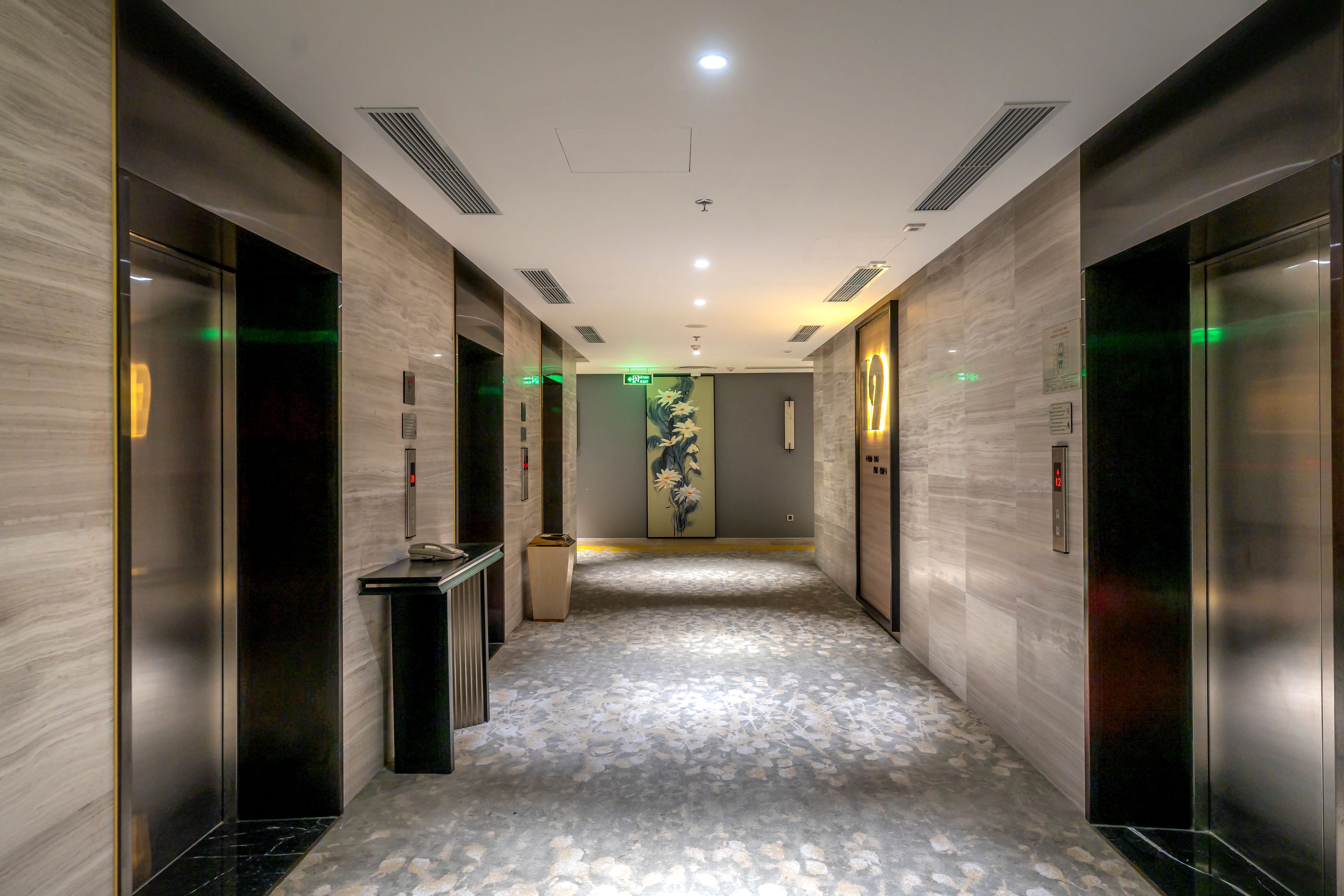 Elegant modern hallway with elevator doors and contemporary interior details
